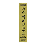 A tall, narrow yellow-green box for Brass Earth incense stands vertically against a soft pink background. The box is printed with the words 'THE CALLING' in large black letters and a small UFO-style graphic near the bottom.