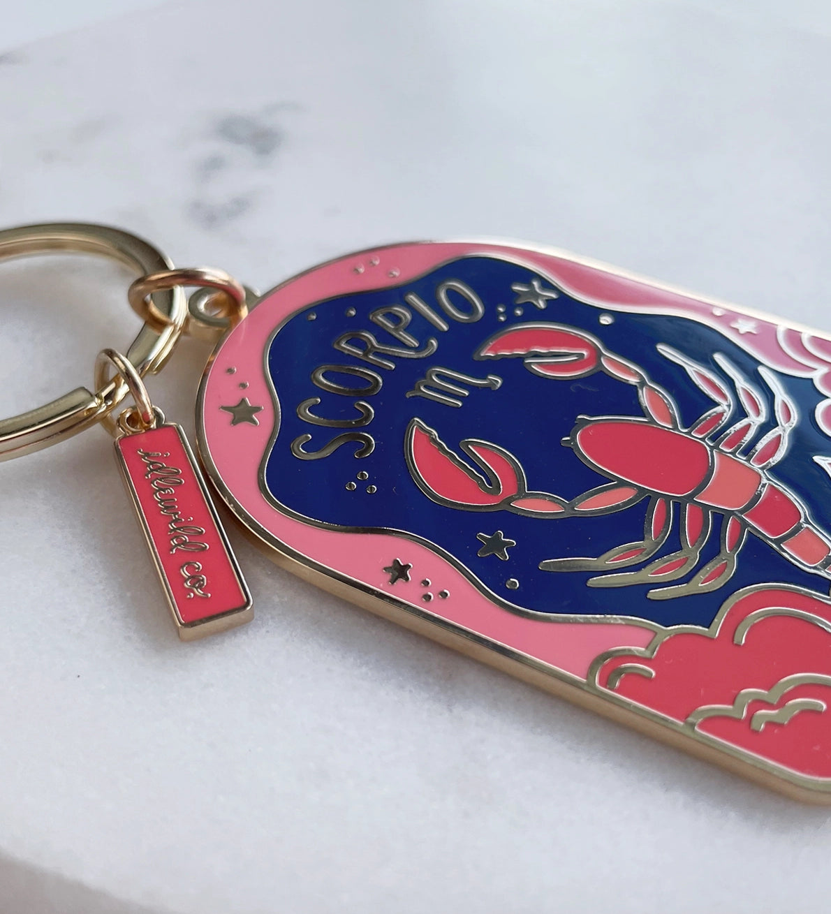 Keychain with lobster design and 'Scorpio' text on a white background