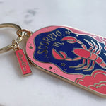 Keychain with lobster design and 'Scorpio' text on a white background