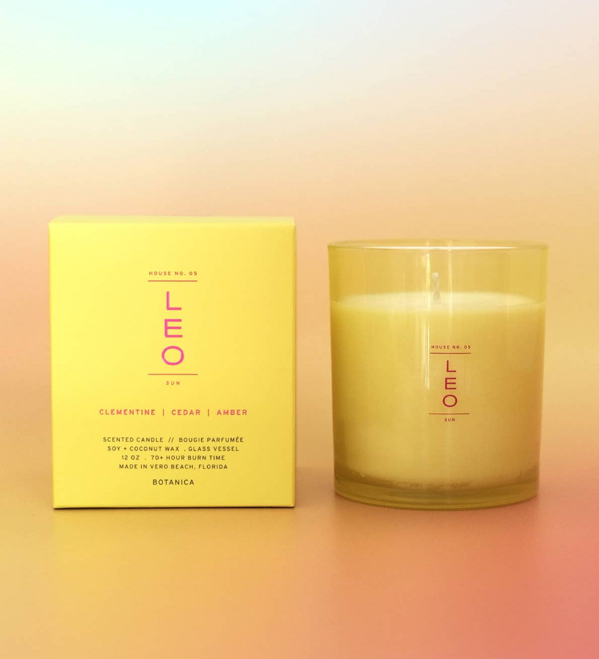 Candle and its packaging with 'LEO' branding on a gradient background