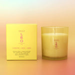 Candle and its packaging with 'LEO' branding on a gradient background