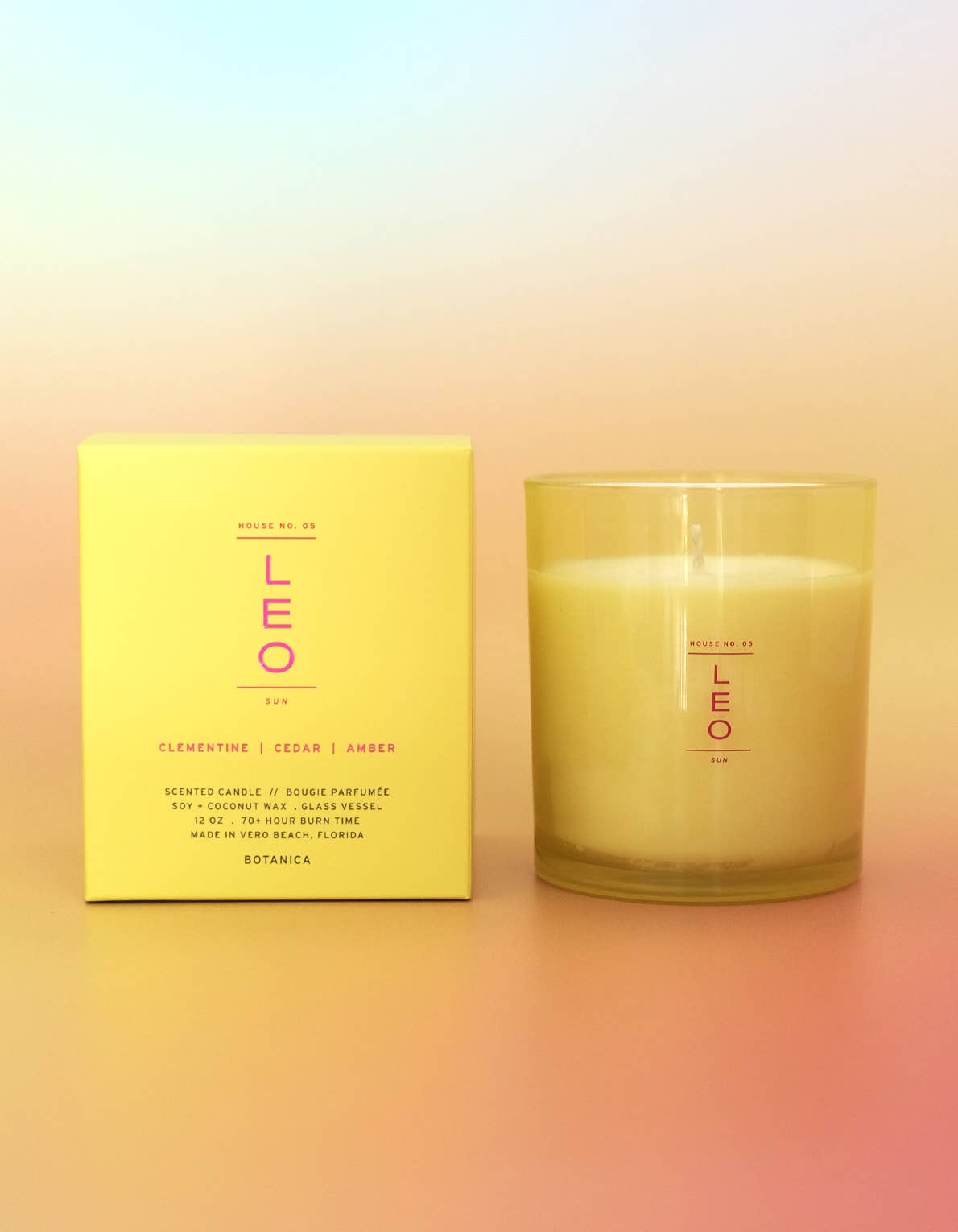 Candle and its packaging with 'LEO' branding on a gradient background