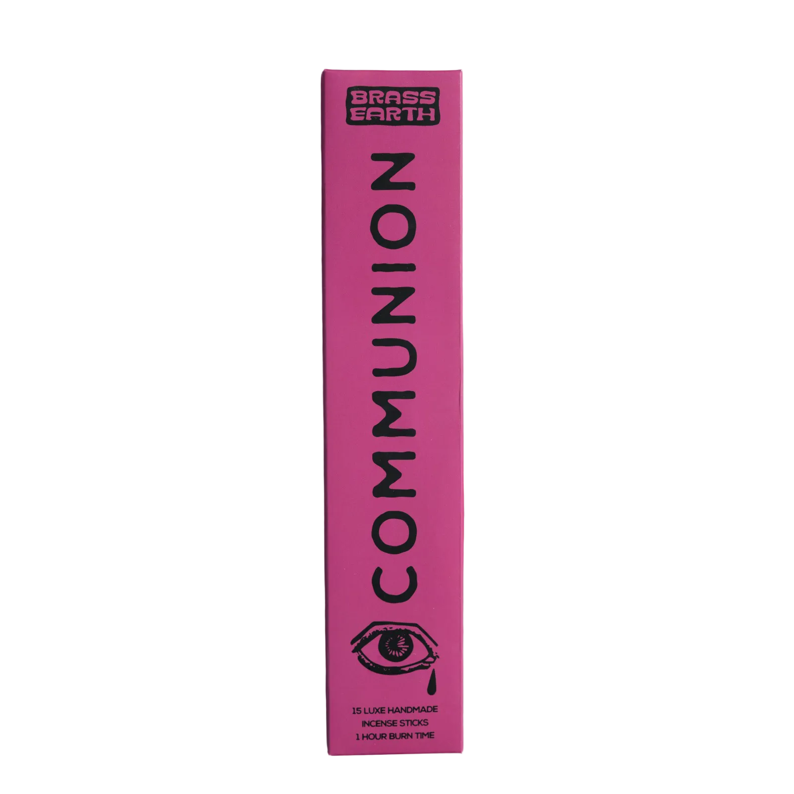 A tall, narrow pink box for Brass Earth Communion skincare stands vertically against a white background. The box features black text reading 'BRASS EARTH COMMUNION' and a black eye illustration near the bottom.