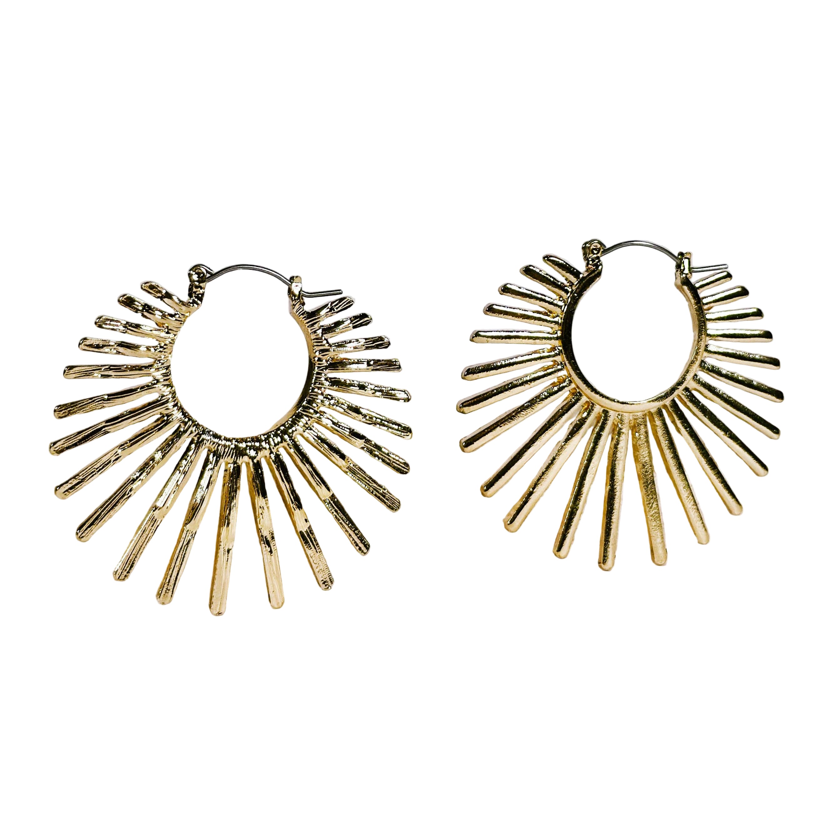 Gold hoop earrings with sunburst design on a light background