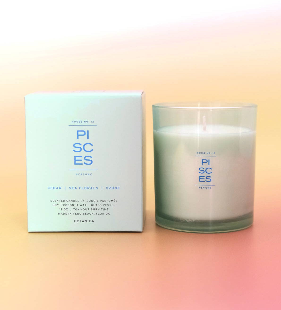 Pisces candle and packaging on a gradient background