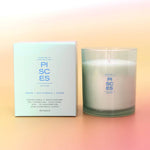 Pisces candle and packaging on a gradient background