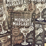 Packages of Craft Cocktail Mixers with 'Midnight Margarita' and 'Practical Magic' branding.
