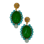 Pair of green and turquoise beaded earrings with gold accents on a light gray background