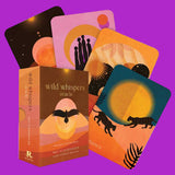 Wild Whispers oracle cards with colorful designs and packaging on a white background