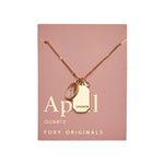 April Gold Birthstone Necklace on pink card - Confía Collective