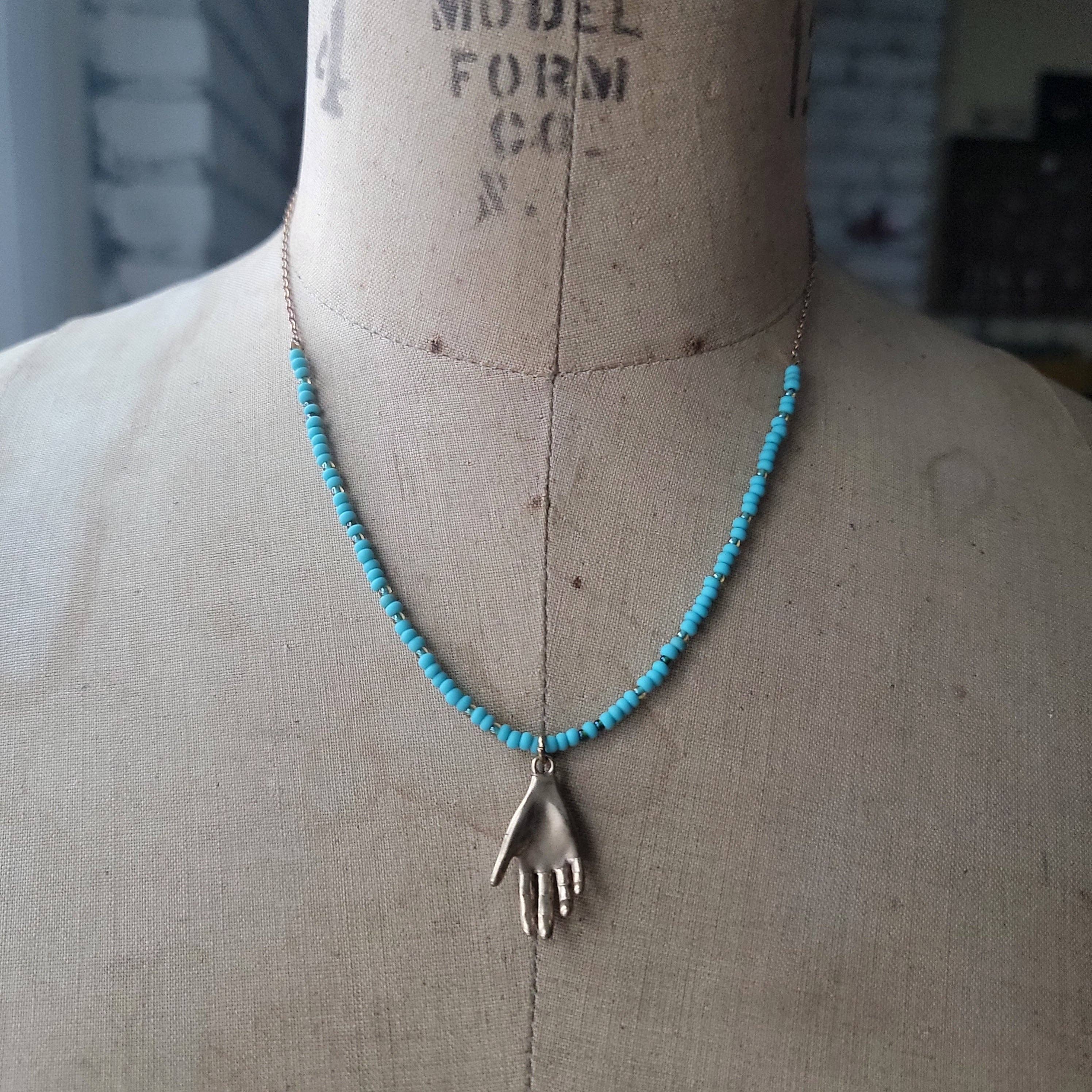 Turquoise Beaded Necklace with Brass Hand - Confía Collective