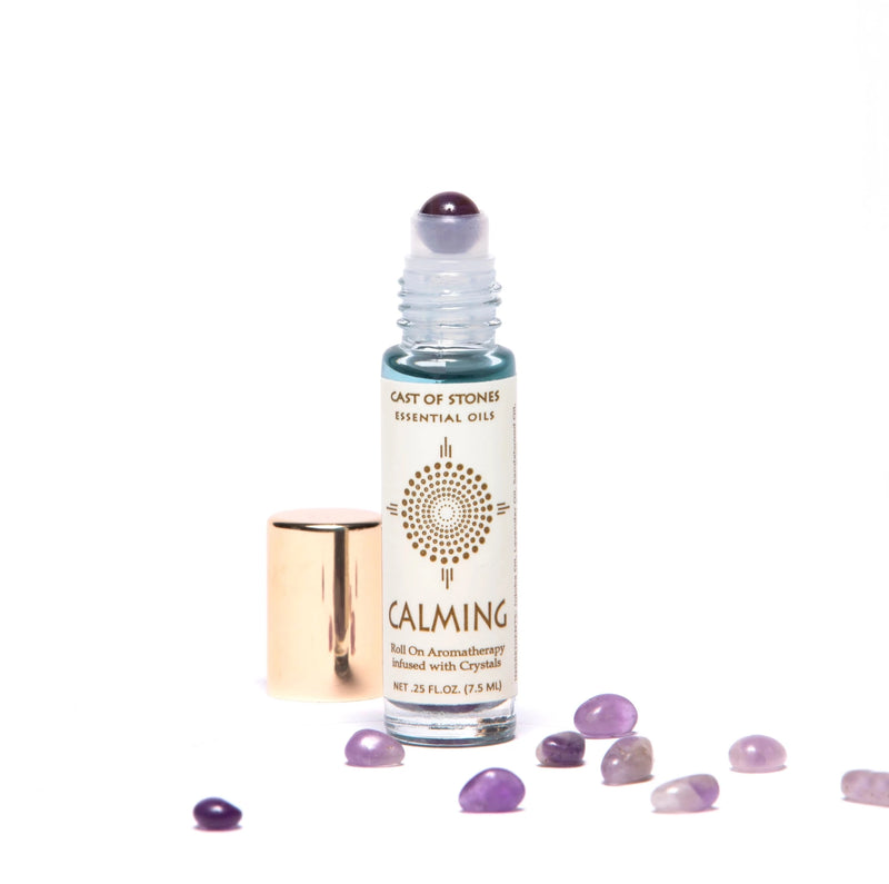 calming essential oil roll on aromatherapy with amethyst crystals.