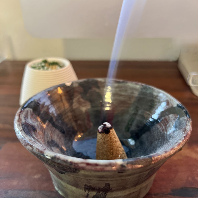 Our incense cones are made by hand and use only sustainably harvested Peruvian Palo Santo wood powder and natural resins of trees to obtain the texture and shape. Simply place one cone in a safe vessel, light the top and let the sweet and woodsy aroma fill your space. Contains 8 cones.