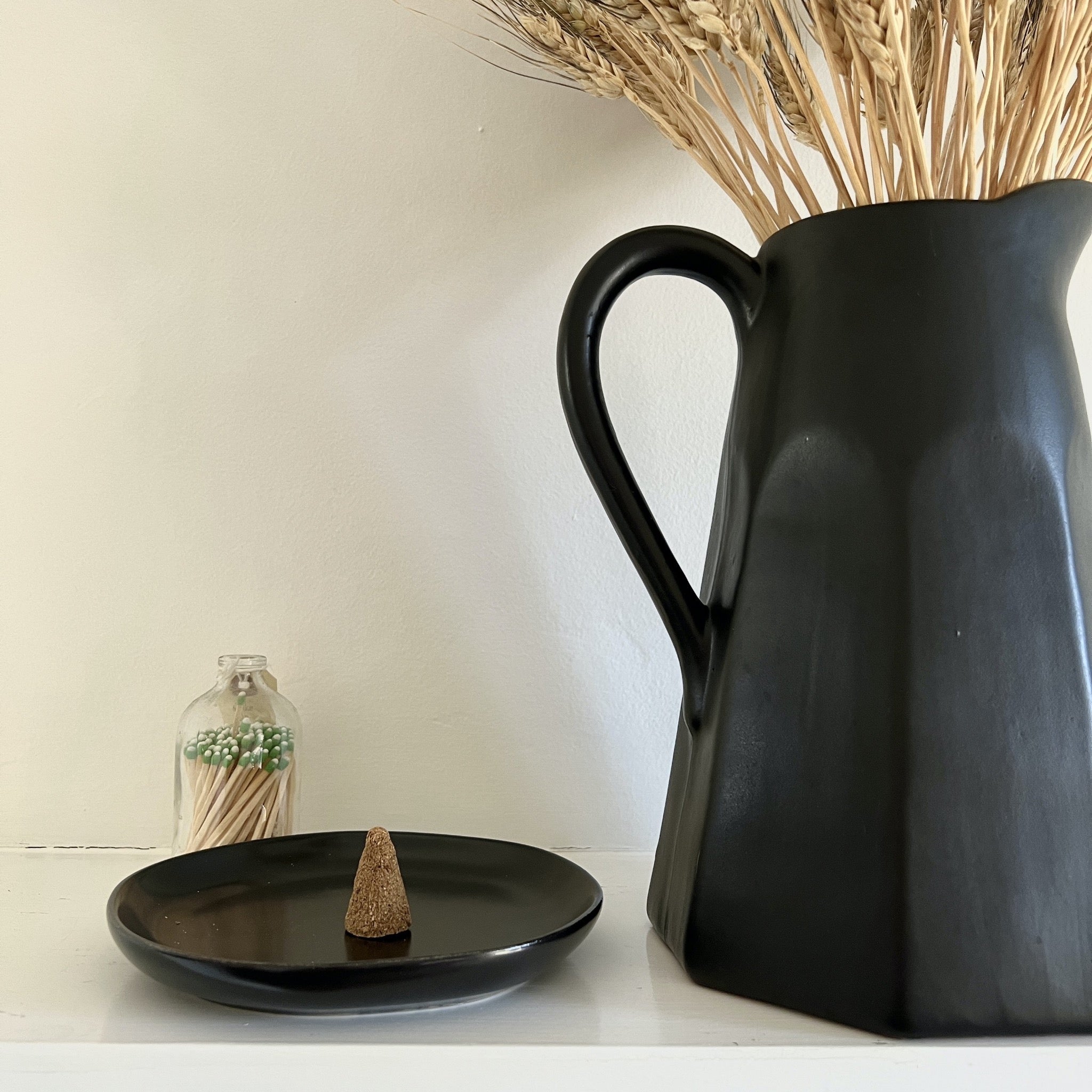 Our incense cones are made by hand and use only sustainably harvested Peruvian Palo Santo wood powder and natural resins of trees to obtain the texture and shape. Simply place one cone in a safe vessel, light the top and let the sweet and woodsy aroma fill your space. Contains 8 cones.