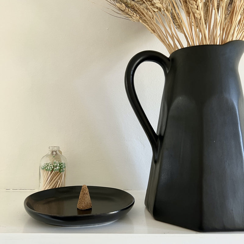 Our incense cones are made by hand and use only sustainably harvested Peruvian Palo Santo wood powder and natural resins of trees to obtain the texture and shape. Simply place one cone in a safe vessel, light the top and let the sweet and woodsy aroma fill your space. Contains 8 cones.