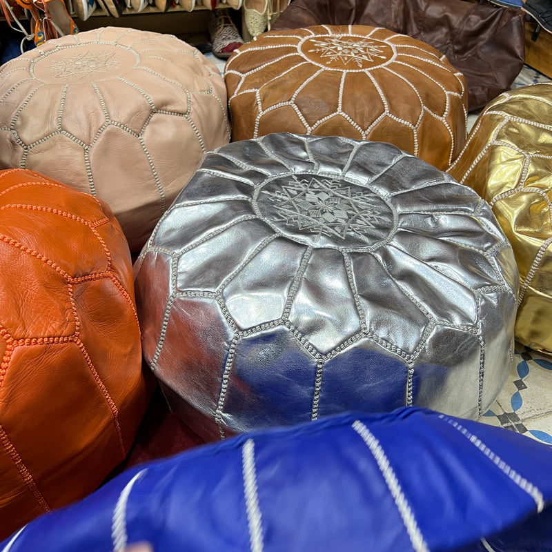 Moroccan leather poufs are handcrafted and hand sewn by artisans in Morocco with goat leather dyed in tanneries that have existed for generations.