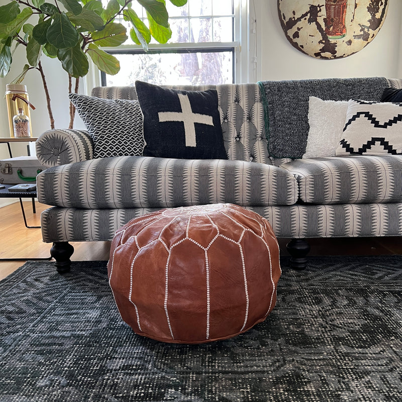 Moroccan leather poufs are handcrafted and hand sewn by artisans in Morocco with goat leather dyed in tanneries that have existed for generations.