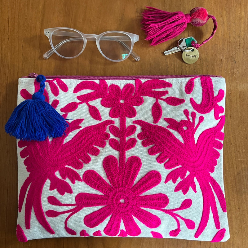 This embroidered Mexican Otomi pouch with colorful tassel will complete your outfit and your day. 