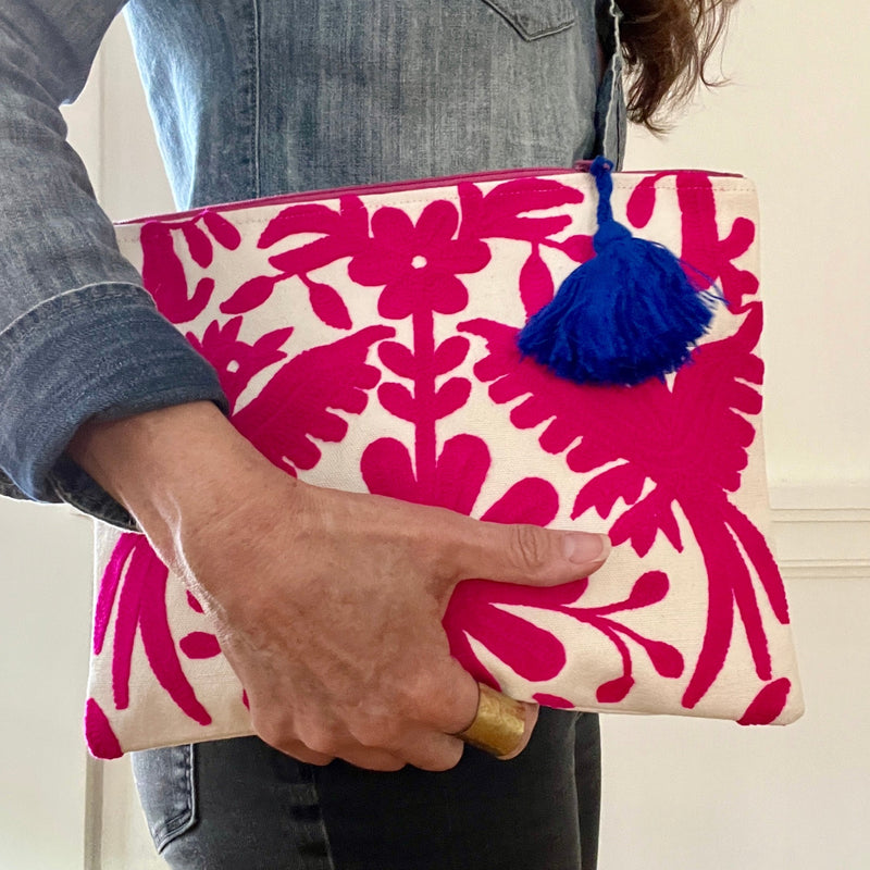 This embroidered Mexican Otomi pouch with colorful tassel will complete your outfit and your day. 