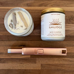 Smudge soy candle with a clear quartz crystal, white sage, and essential oils.
