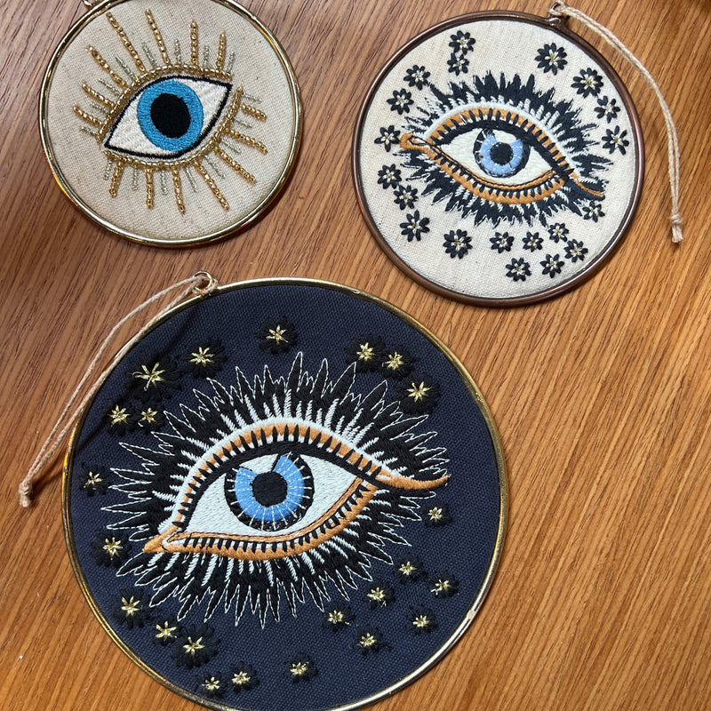 This cream embroidered lucky eye is an all year ornament to cast away negative energy.