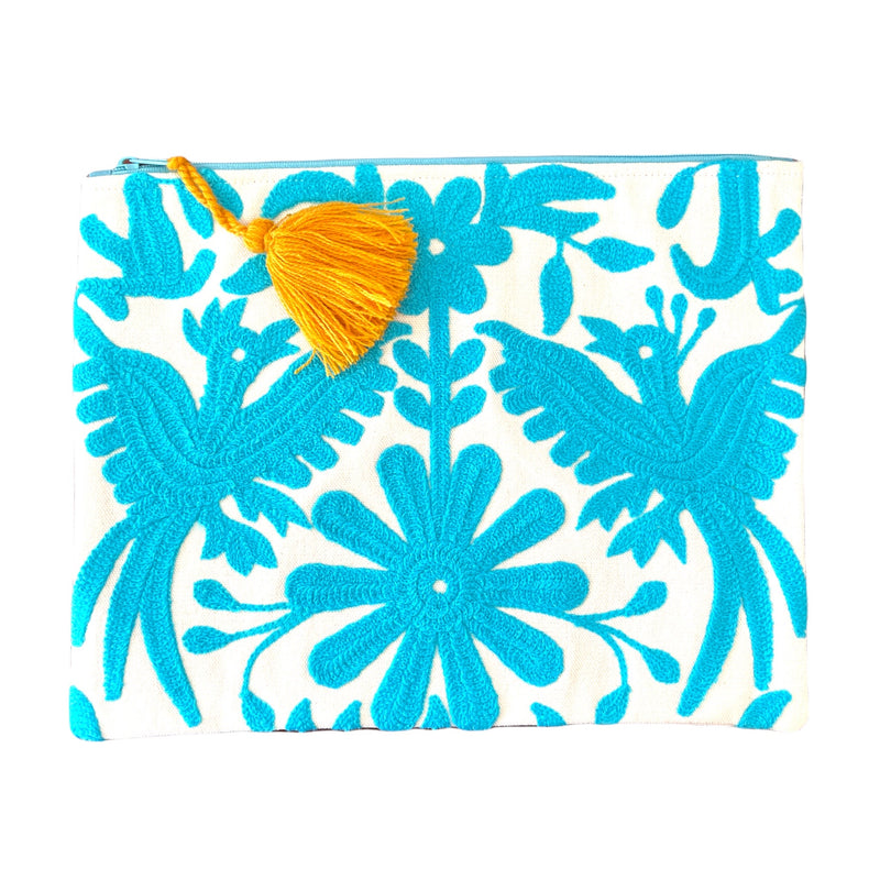This embroidered Mexican Otomi pouch with colorful tassel will complete your outfit and your day. 