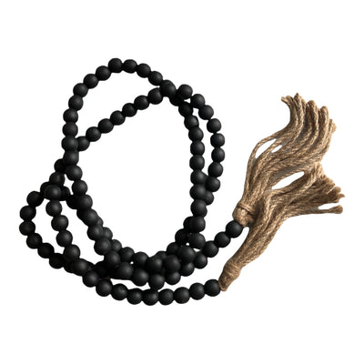 black wood bead strand with rope end tassels