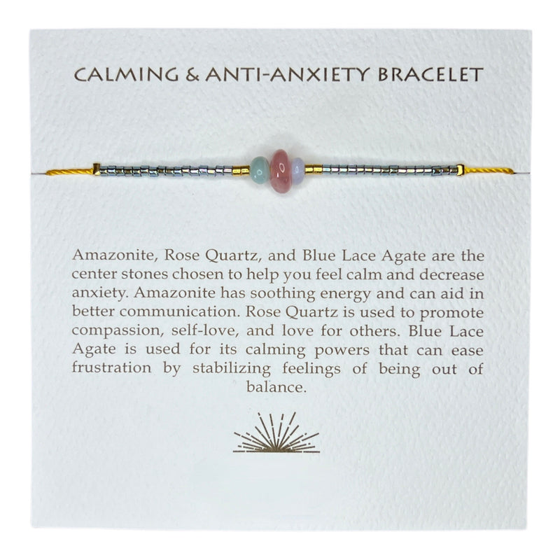 This calming + anti-anxiety bracelet holds iridescent beads and chosen stones on an adjustable gold thread. 