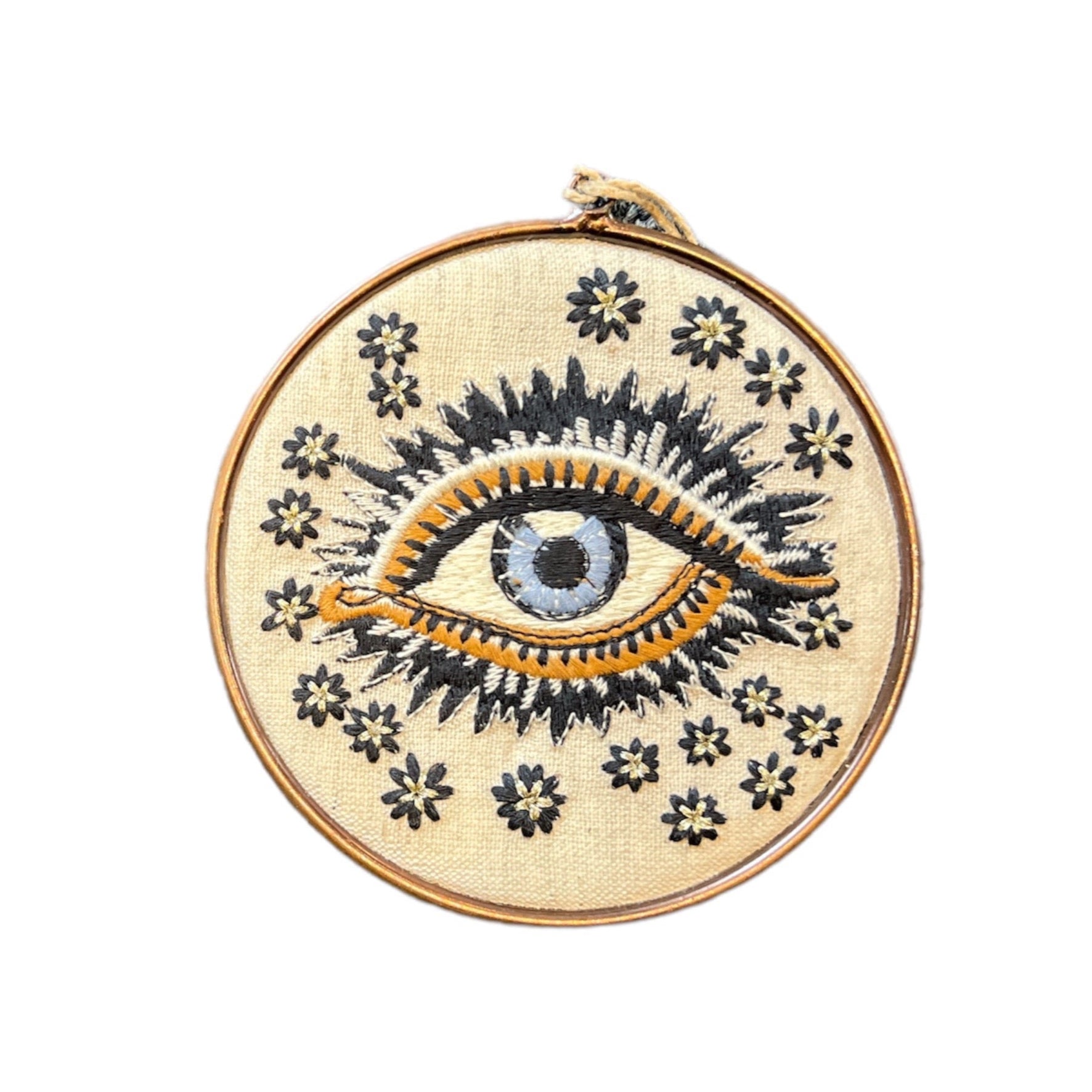 This cream embroidered lucky eye is an all year ornament to cast away negative energy.