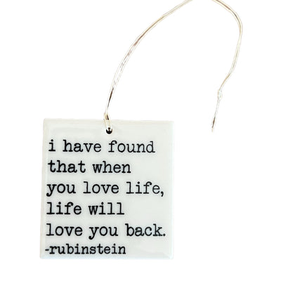 "I have found when you love life, life will love you back." - Rubinstein quote screen-printed porcelain plaques. 2 1/4"x 2 1/4"