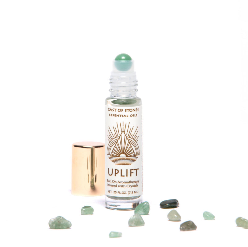 uplift essential oil roll on aromatherapy with green aventurine crystals.