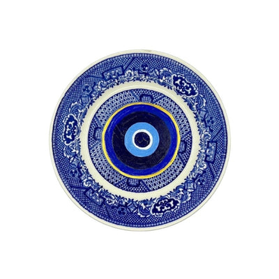 Antique vintage blue plates have been given new life with hand-painted evil eyes. Just the thing we need that we didn't even know we needed.