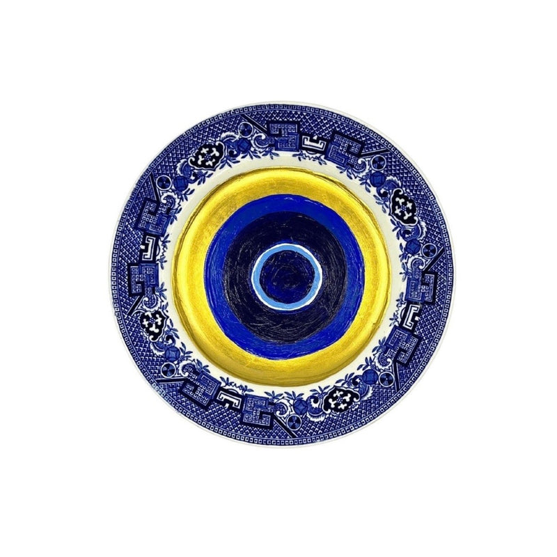 Antique vintage blue plates have been given new life with hand-painted evil eyes. Just the thing we need that we didn&