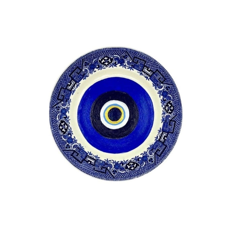 Antique vintage blue plates have been given new life with hand-painted evil eyes. Just the thing we need that we didn&